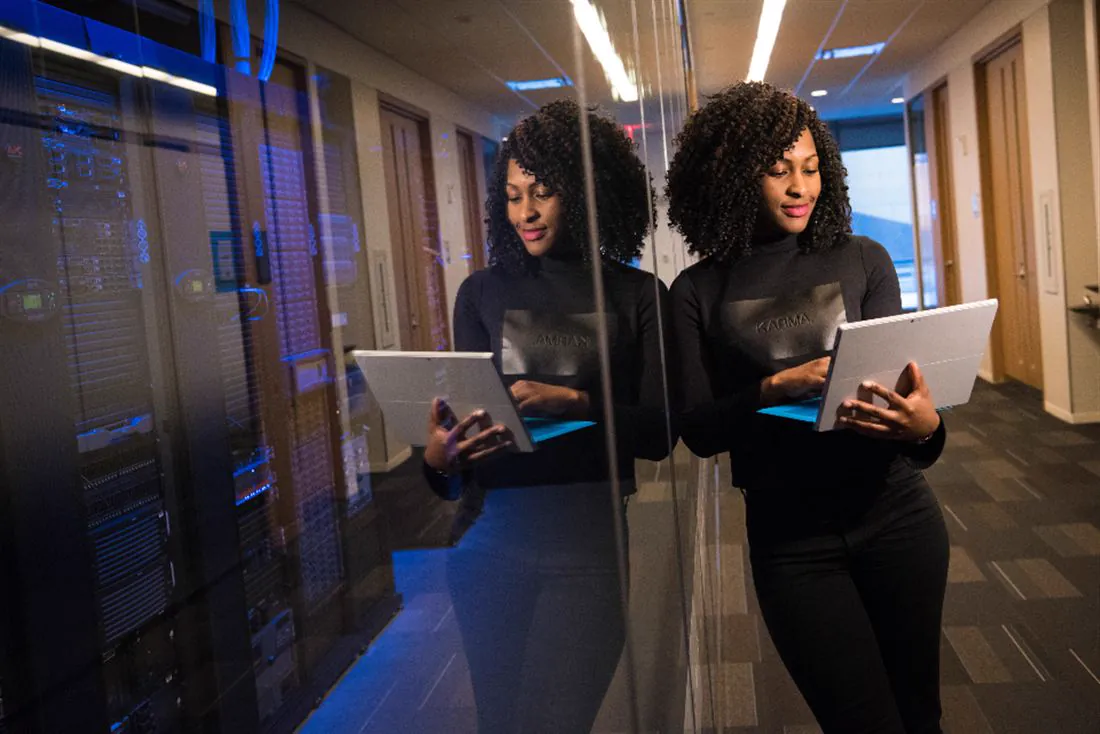 Professionals with tablets in a data center